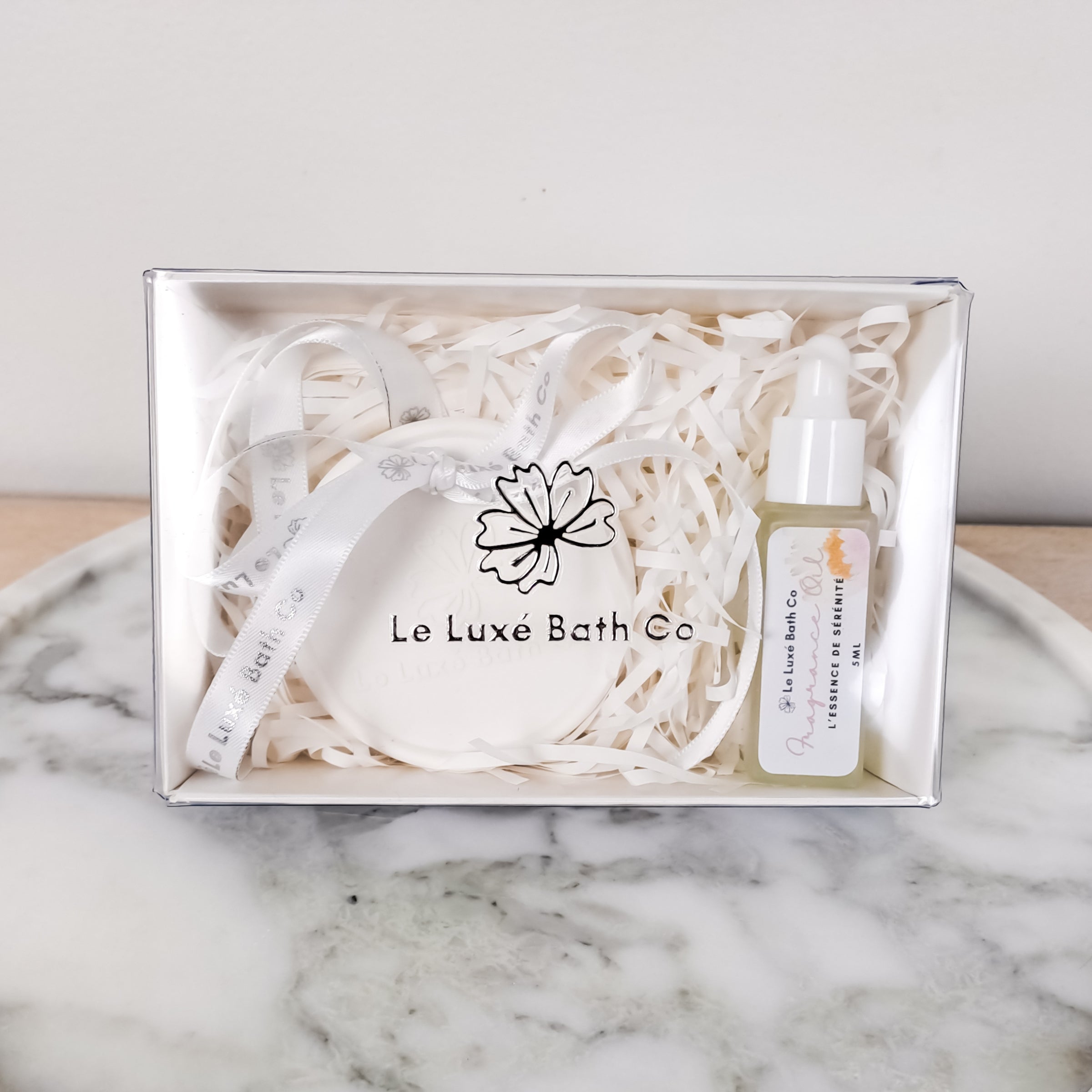 Aroma Disc on marble tray on wood