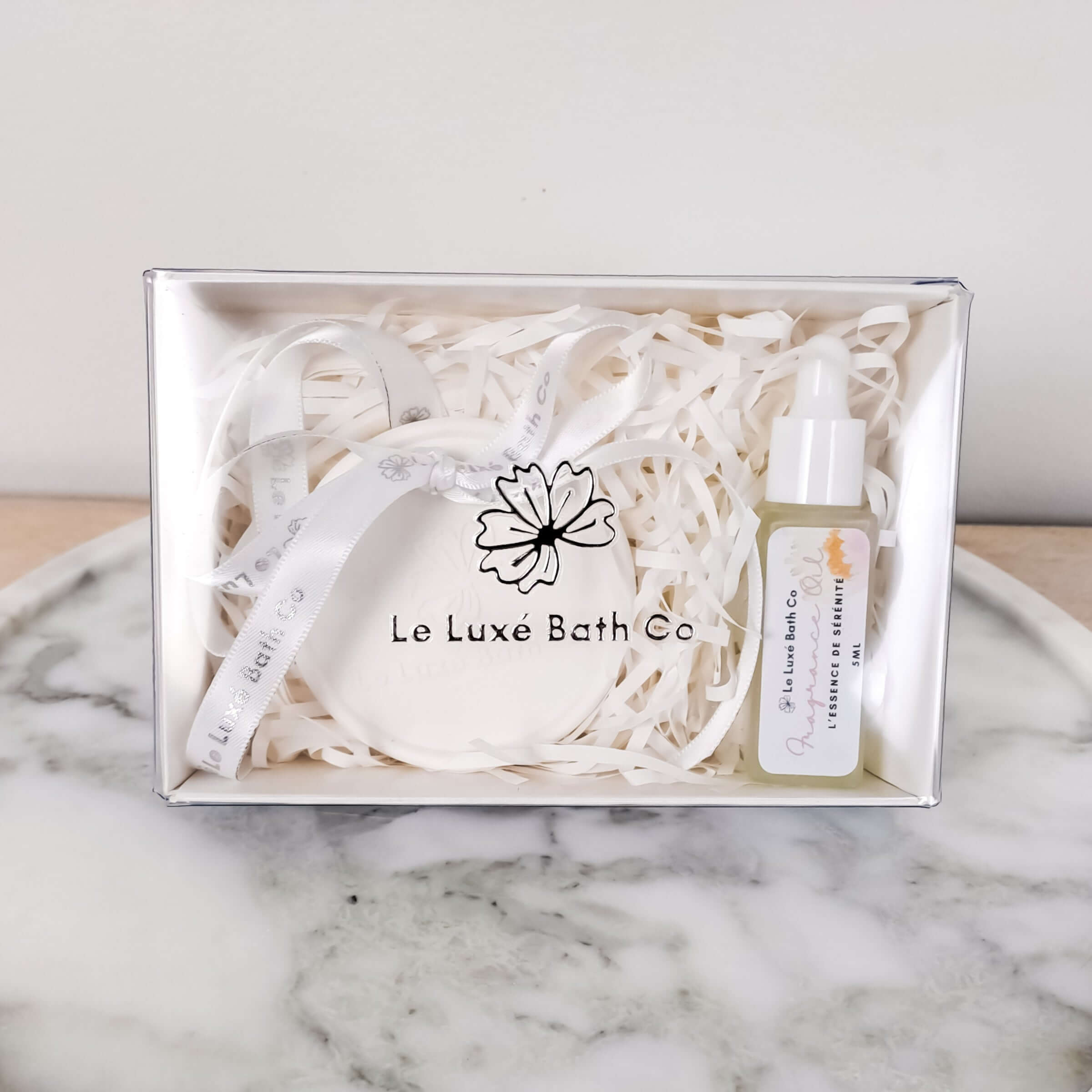 Aroma Disc on marble tray on wood